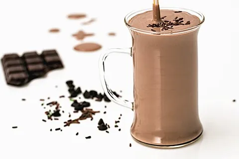 chocolate milk: a sweetened cocoa-flavored drink, typically created by mixing chocolate syrup or chocolate powder...