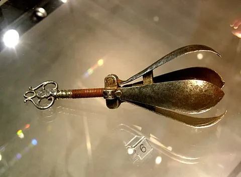 choke pear: a metal torture device to be inserted into the body, consisting of a usually pear-shaped piece...