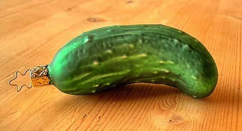 christmas pickle: a Christmas decoration shaped like a pickle, hidden on a Christmas tree, with the finder receiving...