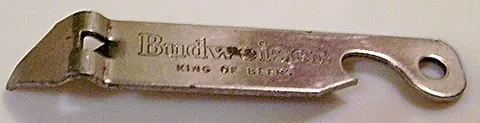 church key: an opener, typically with both can opener and bottle opener features, having a triangular tip that...