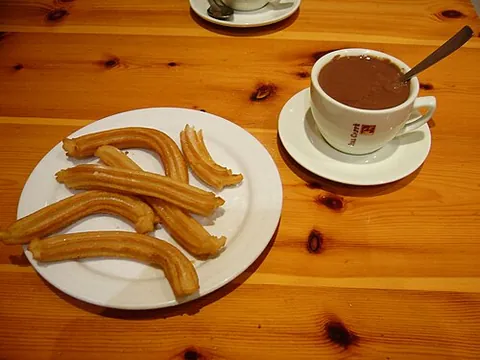 churro: a fried pastry from Spain, typically eaten as a dessert and with chocolate beverage