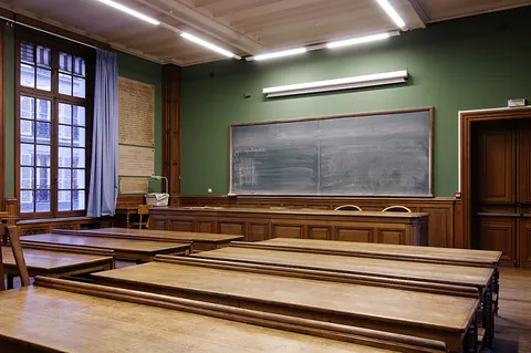 classroom: a room, often in a school, where classes take place