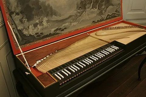 clavichord: an early keyboard instrument producing a soft sound by means of metal blades (called tangents)...