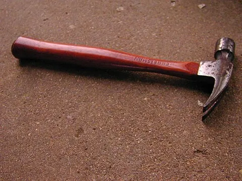 claw hammer: a hammer with two prongs protruding back from the head to allow for removing nails from wood