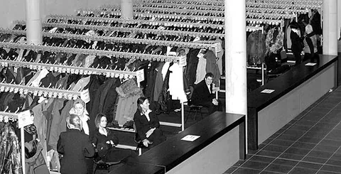 cloakroom: a room intended for holding guests' cloaks and other heavy outerwear, as at a theater or night club