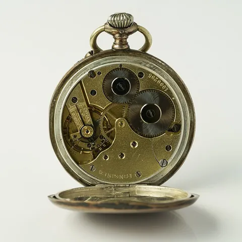 clockwork: a mechanism powered by a coiled spring and regulated by some form of escapement; the power is...