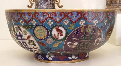 cloisonne: a decorative technique for metalwork, especially brass, whereby colored enamel is baked in...