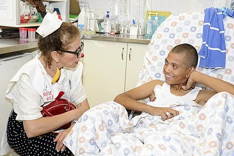 clown doctor: a clown who visits hospitals in a costume which is a combination of attire worn by a clown and a...