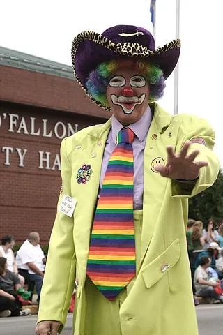 clown: a slapstick performance artist often associated with a circus and usually characterized by bright,...