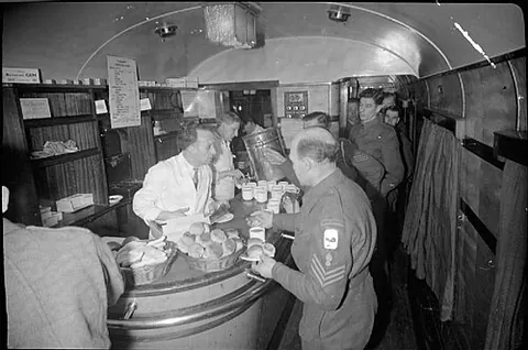 club car: a railroad car that serves in the manner of a club (lounge), offering drinks, snacks, background...