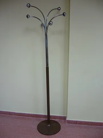 coat rack: a rack or stand with hooks or pegs for holding hats and coats, often placed near an entrance for...
