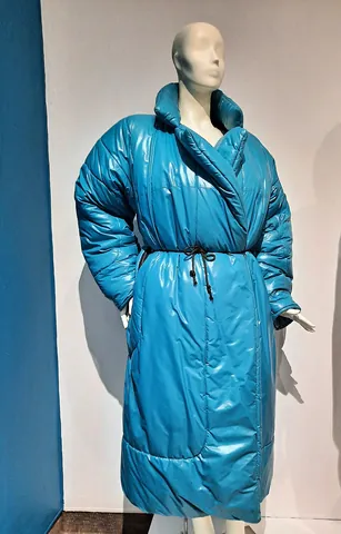 coat: an outer garment covering the upper torso and arms