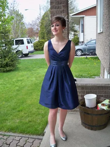 cocktail dress: a type of women's evening dress suitable for semiformal occasions or cocktail parties