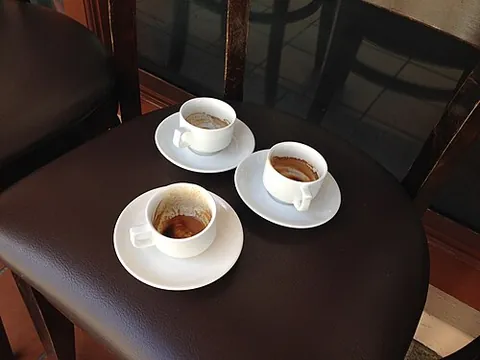 coffee cup: a cup, typically a small one, in which coffee can be served