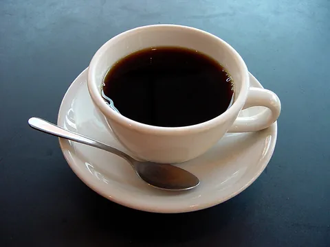 coffee: a beverage made by infusing the beans of the coffee plant in hot water