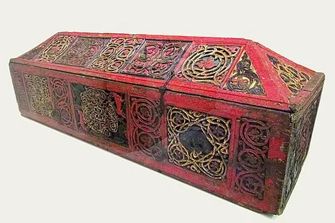 coffin: a closed box in which the body of a dead person is placed for burial