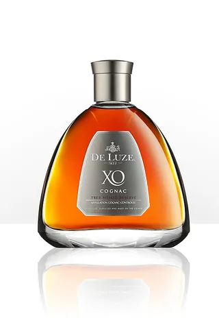cognac: a brandy distilled from white wine in the region around Cognac in France
