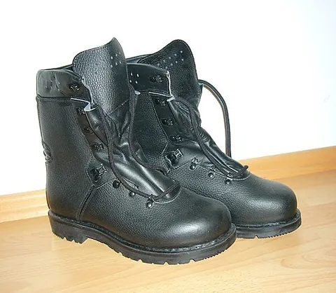 combat boot: a type of boot designed to be worn by soldiers during actual combat or combat training