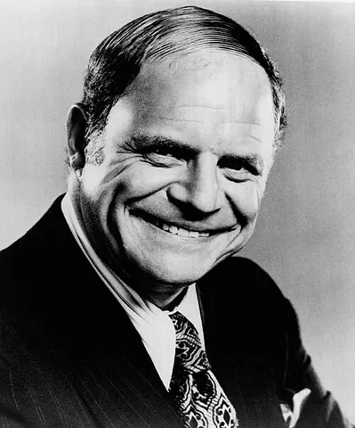 combover: a manner of combing hair from one side to the other in an attempt to conceal a medial bald patch