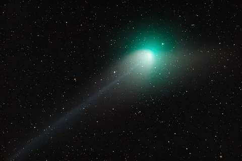 comet: a small Solar System body consisting mainly of volatile ice, dust and particles of rock whose very...