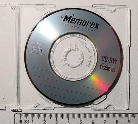 compact disc: a kind of plastic optical disc used to store audio or digital data, read by a laser in a drive