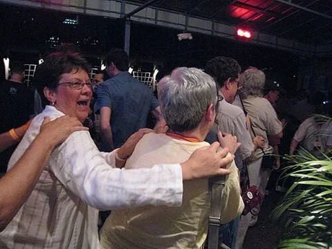conga line: a line of people dancing the conga