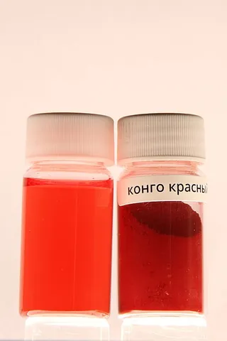 congo red: an azo dye that turns red in alkaline, blue in acidic solutions