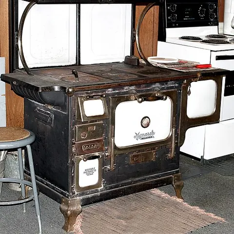 cookstove: a stove used for cooking, especially a primitive kind heated by burning wood, charcoal, dung, etc