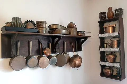 cookware: the assorted objects, such as pots, pans, baking sheets, etc., used for cooking