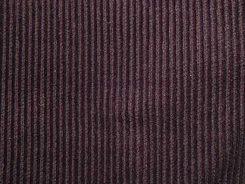 corduroy: a heavy fabric, usually made of cotton, with vertical ribs
