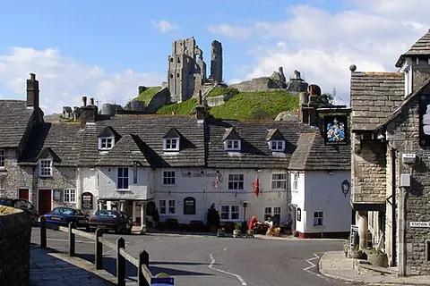 corfe castle: a village and civil parish (named after the ancient castle) in Dorset, England (OS grid ref SY9681)