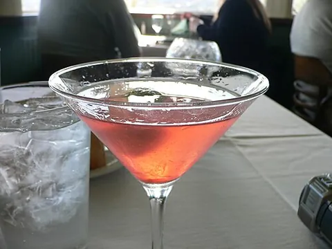 cosmo: a cosmopolitan, a cocktail containing vodka, triple sec, lime juice, and cranberry juice