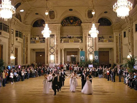 cotillion: a bold dance performed in groups of eight where women lift their skirts to display their ankles
