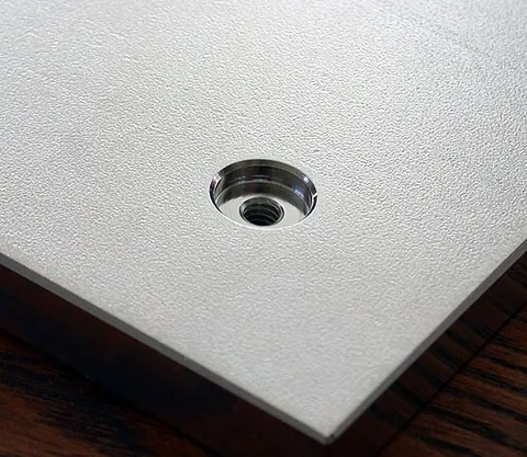 counterbore: a cylindrical recess, typically machined at the mouth of a hole to admit a screw (such as a cap...