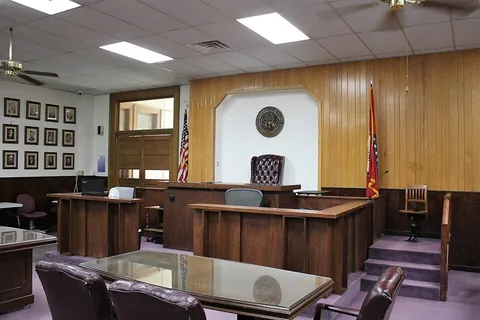 courtroom: the room where a judge presides over hearings and trials, sometimes with a jury