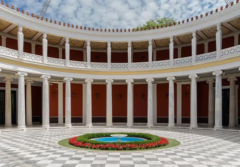 courtyard: an area, open to the sky, partially or wholly surrounded by walls or buildings