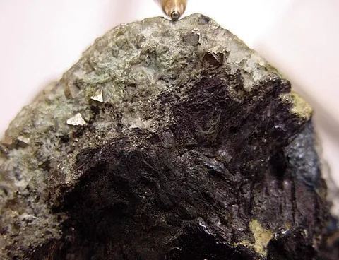 covellite: a shiny indigo-blue sulfide mineral, CuS, that is an ore of copper