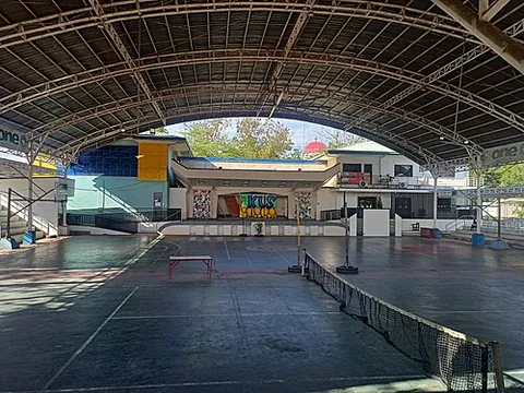covered court: a basketball court under a roof that can be used for other purposes
