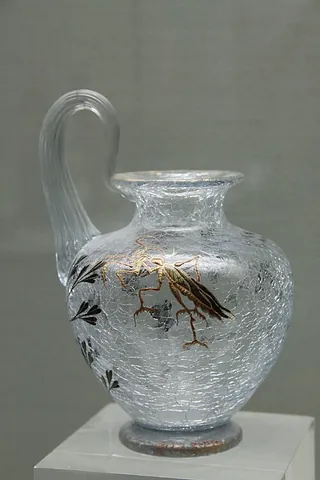 crackle glass: a type of glass with fine cracks, developed in Venice in the 16th century by immersing the hot...