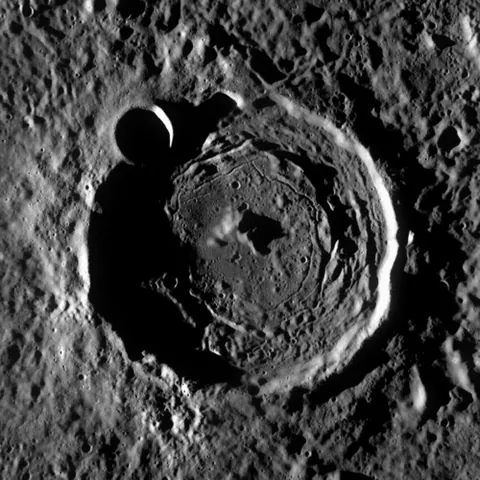 crater: a hemispherical pit created by the impact of a meteorite or other object