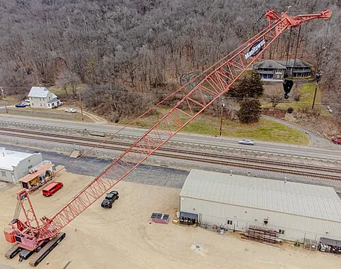 crawler crane: a crane that is able to move around a construction site on its caterpillar tracks