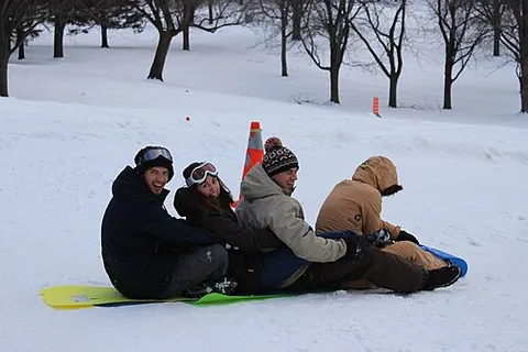 crazy carpet: a thin, flexible sheet of plastic ridden down snowy hills for recreation (akin to a toboggan)