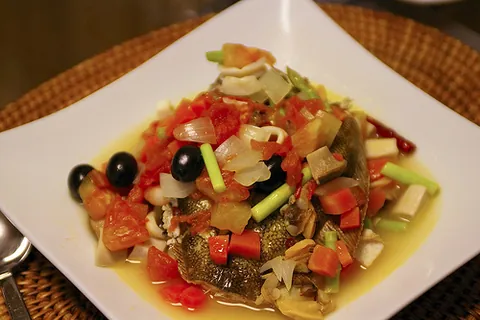 crazy water: an Italian dish of poached whitefish and tomatoes