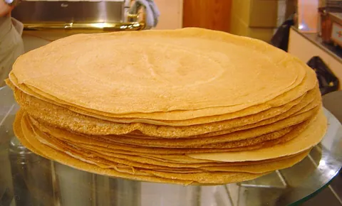 crepe: a flat round pancake-like pastry from Lower Brittany, made with wheat