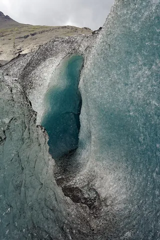 crevasse: a crack or fissure in a glacier or snowfield; a chasm