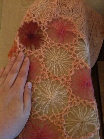 crocheted: made with crochet (needlework made by looping thread with a hooked needle)