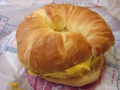 croissandwich: a sandwich which uses a croissant sliced in two as the bread slices