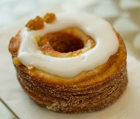 cronut: a pastry which combines characteristics of a croissant and a doughnut. A croissant-based donut. A...