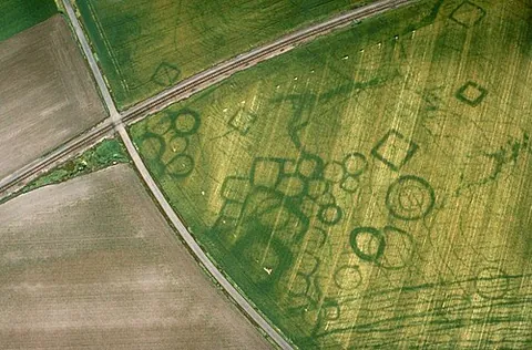 cropmark: a sign of the former location of some feature (such as a wall or a ditch) revealed by variations in...