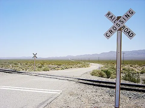 crossbuck: a sign consisting of two slats on a pole forming a diagonal cross, usually indicating a level...